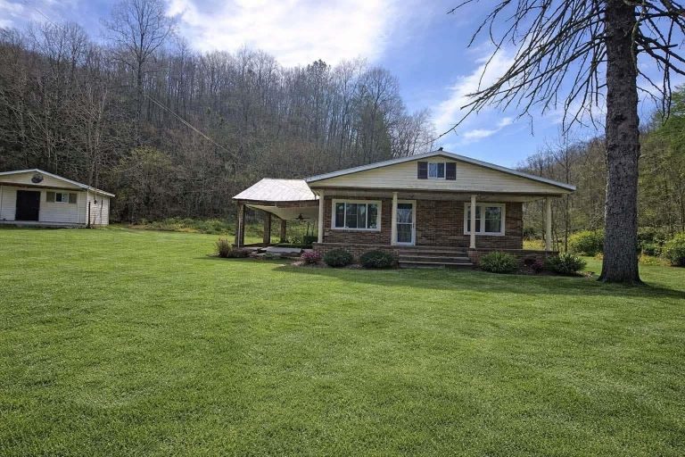 Affordable Brick Home on Nearly Seven Acres with Creek Frontage and Seller Financing Available